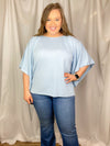 This top features a solid base color, kimono sleeves, knit top, crew neck and runs true to size! Not see through- model has on a nude bra and it was perfect.  *Our photography lights make it seem more sheer than it is-sky