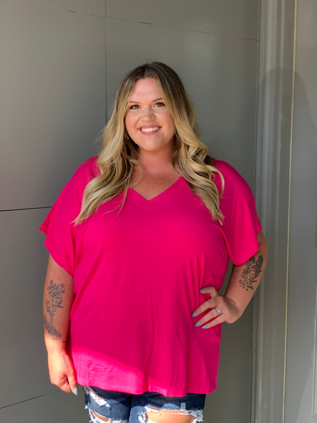 Solid short sleeve oversized V-neck tee with side slit details.  • Short sleeves, V-neck • Oversized silhouette • Side slit accents • Soft and stretchy • Pullover styling • Style with leggings or jeans for an effortless look • Soft and stretchy   - Approximately 25" L - 95% Rayon, 5% Spandex-PINK