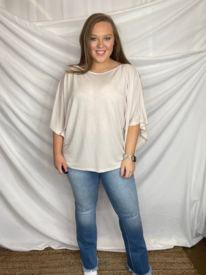 Jeans feature a light wash, knee distressing, flared leg, frayed bottom, functional pockets, 32" inseam, high waisted and runs true to size!   Measurement (Based on size 5) - Inseam: 32" - Rise (To top edge of band): 10" - Leg Opening: 21"  Composition For Color S933: - 73% Cotton/ 25% Polyester/ 2% Spandex