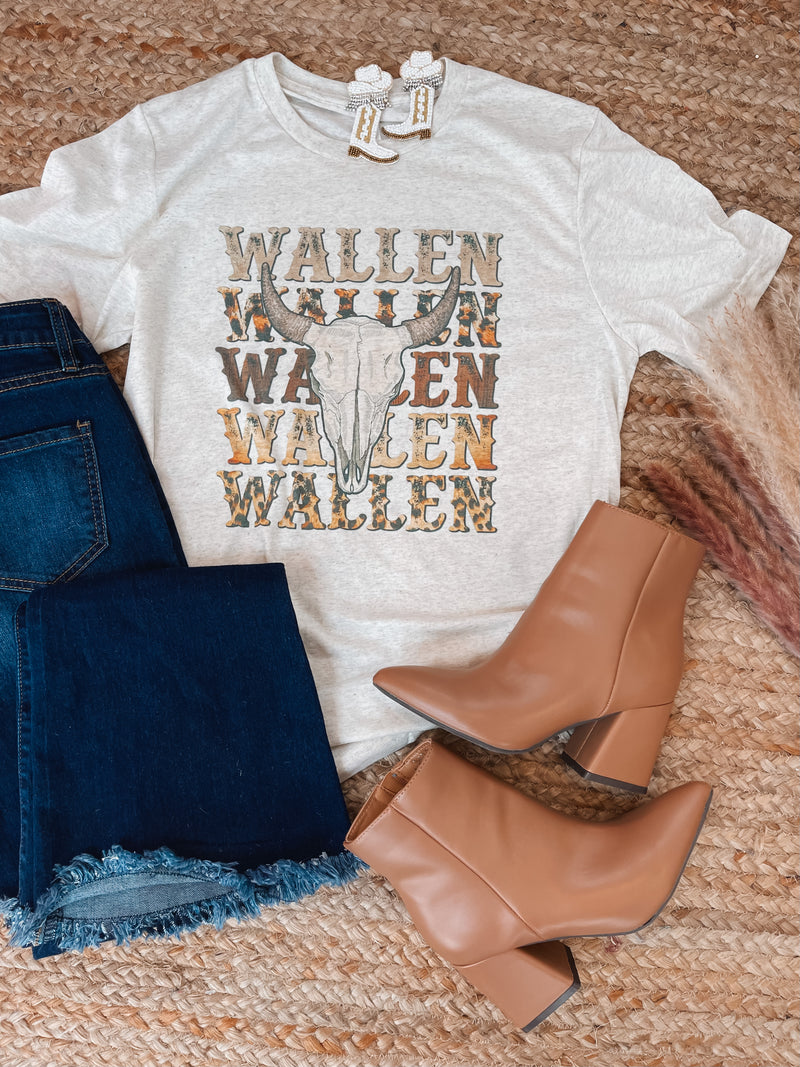 Graphic tee features a heathered neutral colored tee, short sleeves, vintage western design, unisex fit, round neck line and runs true to size! 