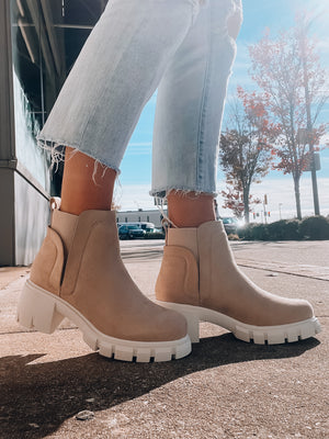 Slip-on booties feature a light camel suede material with a chunky rubber heeled base, and runs true to size!