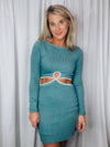 Dress features a teal base, cream outlining detail, cut out side detailing, soft ribbed material, long sleeves, round neck line and runs true to size! 