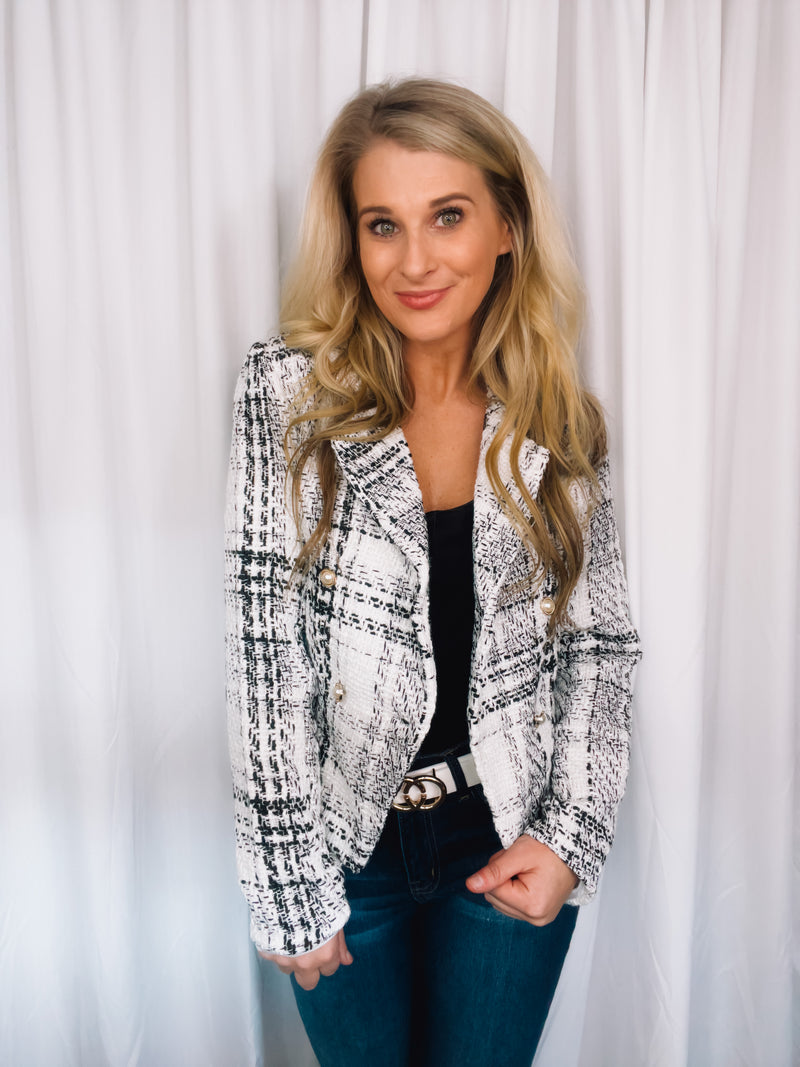 Blazer features a tweed material, long sleeves, underlining detail, V-neck line, front button closure and runs true to size! 