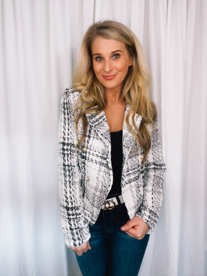 Blazer features a tweed material, long sleeves, underlining detail, V-neck line, front button closure and runs true to size! 
