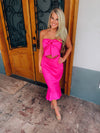 Dress features a solid base color, strapless detail, high-low hem line, front tie bow, mermaid fit and runs true to size! -hot pink