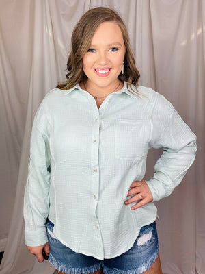 Top features a light sage color, long sleeves, raw hem line detailing, functional button up detail (breast feeding friendly), collar detail, lightweight but not thin material and runs true to size! 
