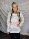 Sweater features an ivory base, thin multi colored stripes, round neck line, long sleeves, soft material and runs true to size! -CORAL