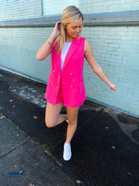 Blazer features a jaw dropping hot pink color, sleeveless detail, open front detail, front pockets, functional buttons and runs true to size!   Matching shorts feature a zip up closure, upper thigh length, belt detail, functional pockets and runs true to size! 