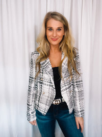 Blazer features a tweed material, long sleeves, underlining detail, V-neck line, front button closure and runs true to size! 