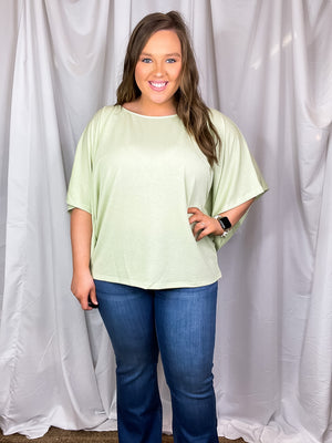 This top features a solid base color, kimono sleeves, knit top, crew neck and runs true to size! Not see through- model has on a nude bra and it was perfect.  *Our photography lights make it seem more sheer than it is-mint