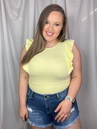 Bodysuit features a suede material, short sleeves, snap bottom detail, ruffle side detailing, round neck line, fitted fit and runs true to size!-yellow