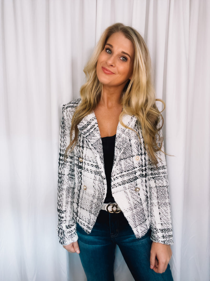 Blazer features a tweed material, long sleeves, underlining detail, V-neck line, front button closure and runs true to size! 