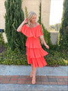 Dress features a coral color, layered detailing, off/on shoulder detail, underlining, midi length and runs true to size! 