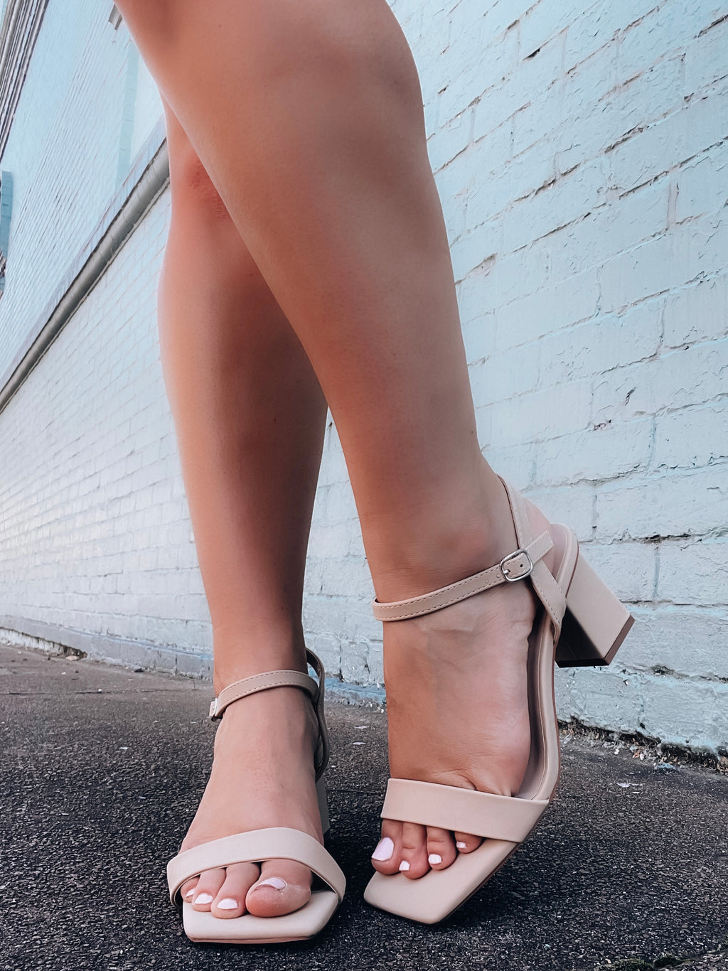 Heels feature a nude color, cross toe strap, low heel, ankle strap detail and runs true to size! 