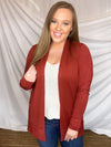 Cardigan features a solid base color, long sleeve, thin material, light weight material, 2 front pockets and runs true to size!- RUST