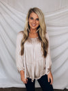 Top features a light champagne color, peasant sleeves, ruffled detail, elastic waist/ shoulder, loose fit, can be worn on or off the shoulder and runs true to size! 