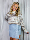 Skort features a light dusty blue color, pleather material, front overlay, mini length and runs true to size! 