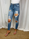 Jeans feature a medium denim wash, front distressing, high waist detail, mom jean fit, functional pockets and runs true to size! 