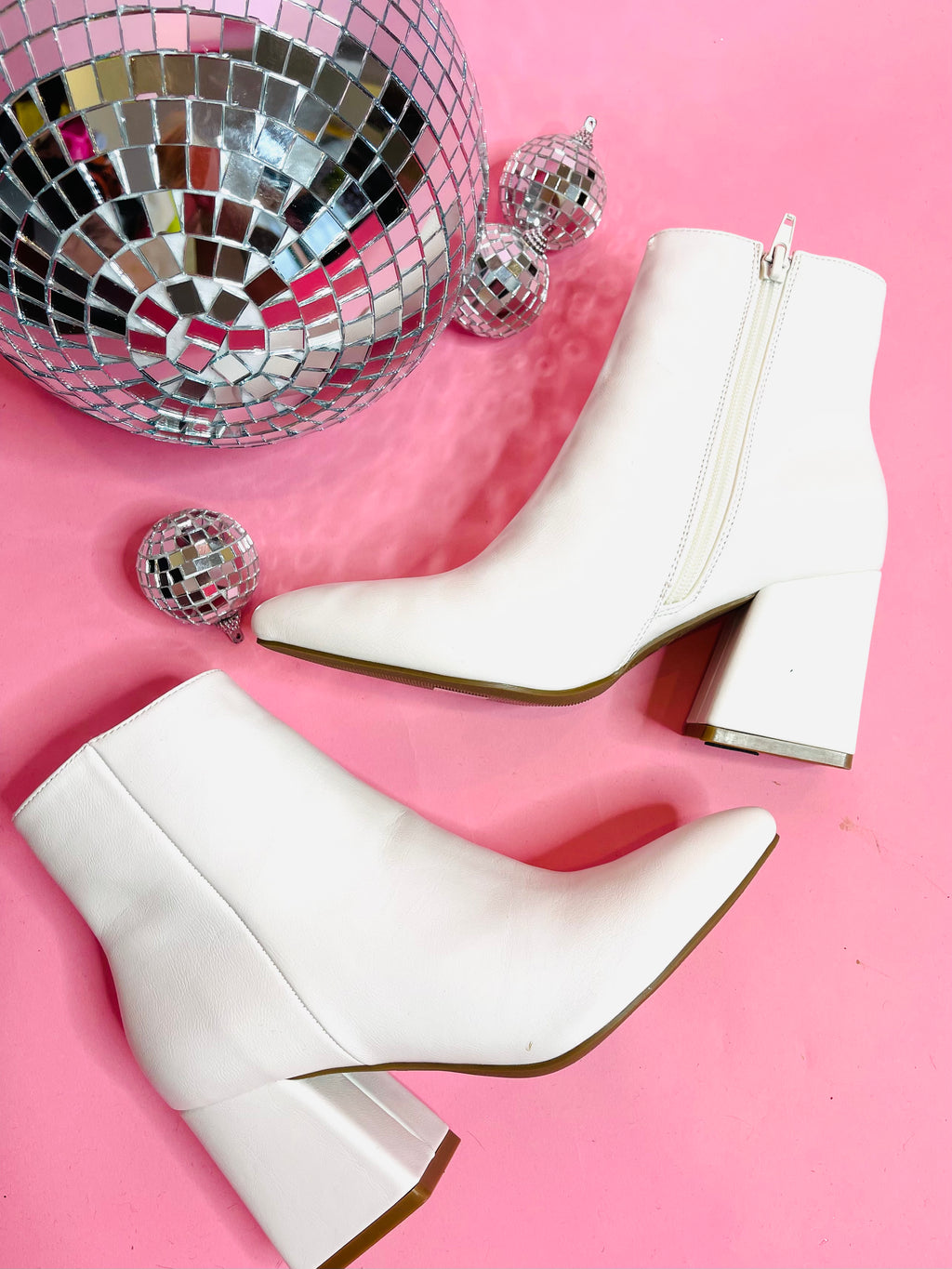 Booties feature a plain white base, block heel, full zip up detailing and runs true to size! 