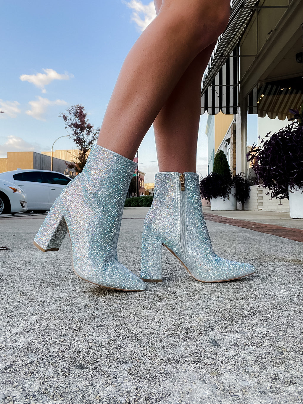 Booties feature a show stopping appearance, block heel, full sequin/rhinestone detailing, side zip-up closure and runs true to size! -silver