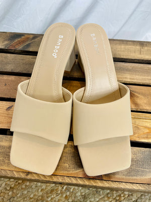 Shoes features a square toe, comfy base, open toe. nude color and runs true to size! 