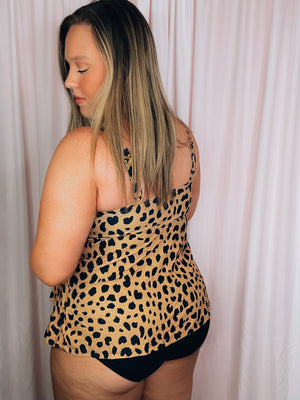 Be the wild one in our daring From The Wild One Piece Swimsuit. Featuring an eye-catching leopard print, layered skirt detail, adjustable straps, and full coverage, this playful swimsuit is as flattering as it is fierce and sure to turn heads! So don't be shy, rock it and roar! 