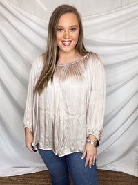 Top features a light champagne color, peasant sleeves, ruffled detail, elastic waist/ shoulder, loose fit, can be worn on or off the shoulder and runs true to size! 