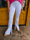 Bottoms feature a white jean material, functional pockets, bottom inside slits and runs true to size! 