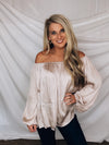 Top features a light champagne color, peasant sleeves, ruffled detail, elastic waist/ shoulder, loose fit, can be worn on or off the shoulder and runs true to size! 