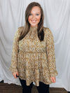 Top features a mustard base, long sleeves, white and black spotted detail, ruffle detail, round neck line, button closure and runs true to size! 