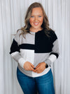 Top features a color block detail, long sleeves, soft material, round neck line, comfortable fit and runs true to size-black