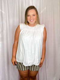 Bottoms feature a olive base, white striped detail, elastic drawstring, side pockets, fully lined and runs true to size! 