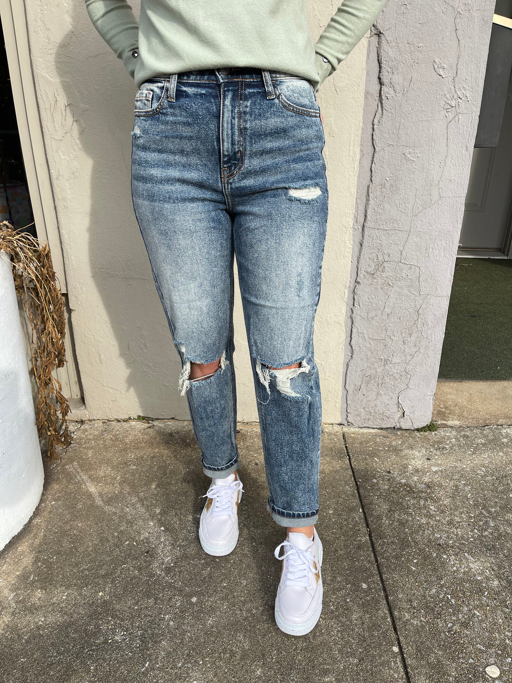 Fierce Mood Mom Jeans offer a modern take on the classic mom jean. Constructed with a durable dark denim wash, these jeans are designed with a high waist and distressed detailing, finished with a classic cuff hem. Enjoy the perfect balance of comfort, style and quality.