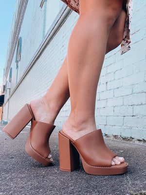 Heels feature a solid color, wide block heel, wide toe strap detail and runs true to size!-brown