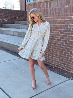 Dress features a solid base color, white floral print, long sleeves, fully lined underneath, long sleeves, ruffle detailing and runs true to size! -sage