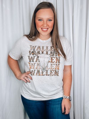 Graphic tee features a heathered neutral colored tee, short sleeves, vintage western design, unisex fit, round neck line and runs true to size! 