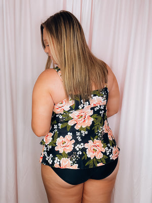 Say bon voyage to boring swimwear with this stylish Set Sail One Piece Swimsuit! Featuring a bold black and pink floral print, adjustable straps, and a layered skirted detail, you'll be sure to make waves when you hit the beach. Ready to anchor your style? Then set sail in this flattering and full coverage one piece!