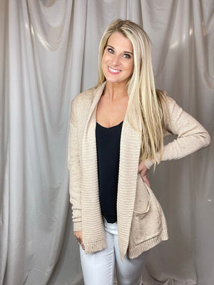 Cardigan features an oatmeal base, heathered detail, open front, long sleeveless light weight material and runs true to size! 