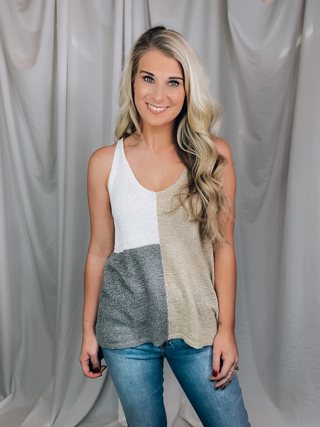 Features a knitted, soft material, sleeveless detail and a color block base. Perfect tank to have all summer long. Fits true to size!