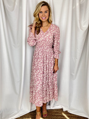 Dress features a dusty rose base, white floral print, midi length, 3/4 sleeves, elastic waist and wrist, knee length underlining, V-neck line and runs true to size! 