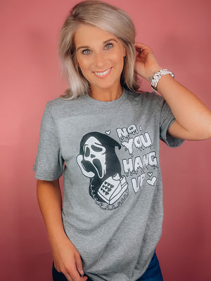 Graphic features a solid base color, black & white scream design, short sleeves, unisex fit and runs true to size! -grey