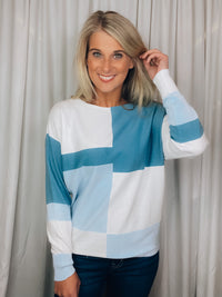 Top features a color block detail, long sleeves, soft material, round neck line, comfortable fit and runs true to size-blue