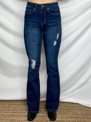 Jeans feature a dark wash denim, small distressing detailing, functional pockets, belt loops, zipper and button closure, flare bottom, 34 " inseam and runs true to size! 