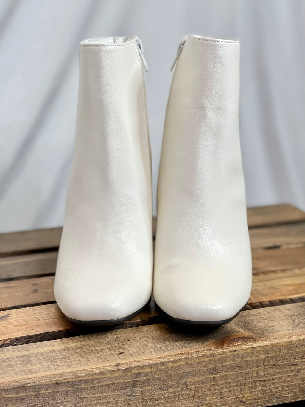 These booties feature a white color, square toe, 3-inch heel, zipper closure and run true to size! 