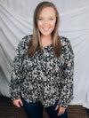 Top features a black base, taupe and cream abstract print, long sleeves, V-neck line, comfy fit and runs true to size! 