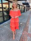 Dress features a coral color, layered detailing, off/on shoulder detail, underlining, midi length and runs true to size! 