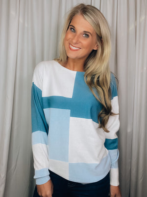 Top features a color block detail, long sleeves, soft material, round neck line, comfortable fit and runs true to size-blue