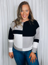 Top features a color block detail, long sleeves, soft material, round neck line, comfortable fit and runs true to size-black