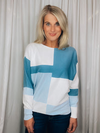 Top features a color block detail, long sleeves, soft material, round neck line, comfortable fit and runs true to size-blue