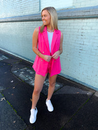 Blazer features a jaw dropping hot pink color, sleeveless detail, open front detail, front pockets, functional buttons and runs true to size!   Matching shorts feature a zip up closure, upper thigh length, belt detail, functional pockets and runs true to size! 